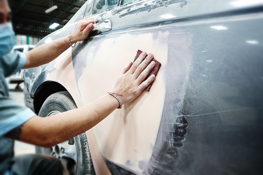 Car body work auto repair paint after the accident during the spraying